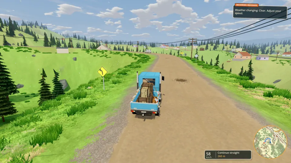 Hauling strapped cargo along a gravel road through the mountain county.