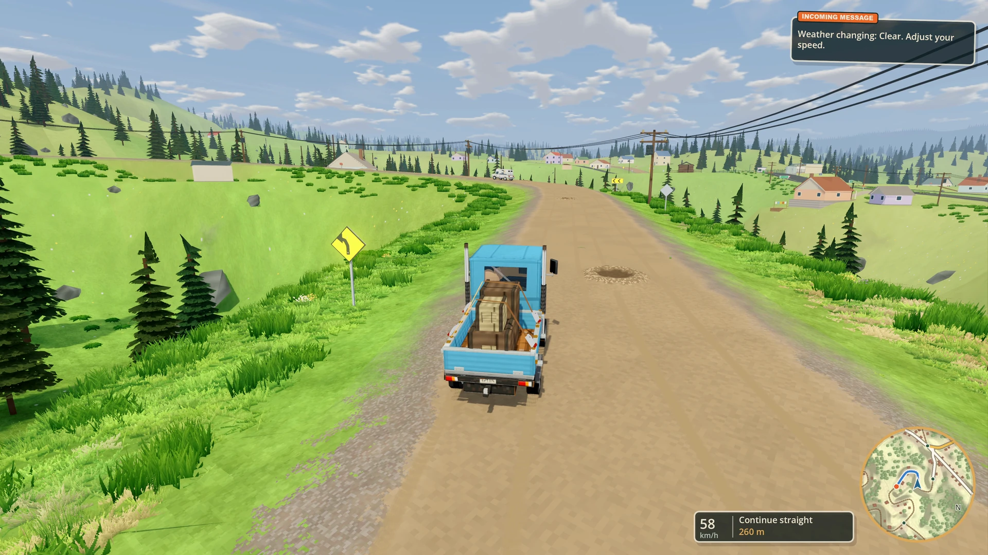 Hauling strapped cargo along a gravel road through the mountain county.